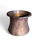A Turkish copper pot in the shape of a curved chim