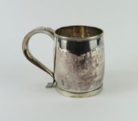 An engraved silver mug with curved body and ribbon