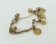 A 9ct gold twisted link bracelet with a heart padl