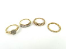 A 9ct gold five stone diamond ring, in a crossover
