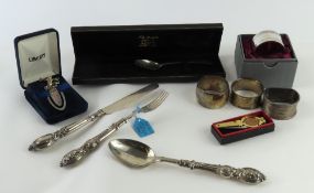 A collection of silverware and other items, includ