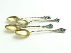 A set of four gilded and enamel coffee spoons, pos
