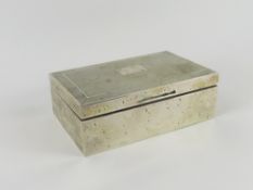 A silver cigar box with wooden interior. Smooth, w