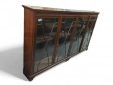 A very large Edwardian bookcase of five adjustable