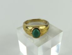 A 9ct gold malachite dress ring, the oval cabochon