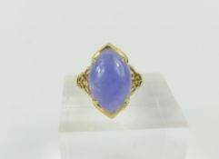 A 9ct gold lilac jade dress ring, the cabochon cut