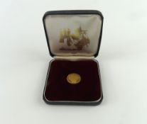 Football interest - a gold coin/medal with design