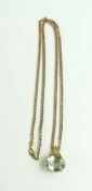 A 9ct light green stone and white stone pendant, t