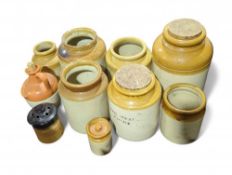 A quantity of stoneware storage jars