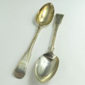 Two Irish silver serving spoons, each with fiddle