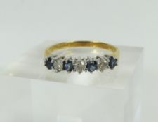 An 18ct gold sapphire and diamond half eternity ri