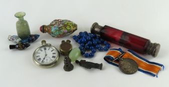 A collection of curios, to include a string of lap