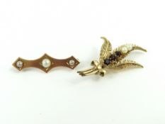 A 9ct gold brooch in the form of a bunch of leaves