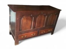 A 19th century stained oak mule chest upon straigh