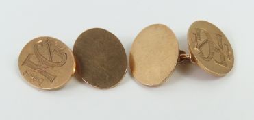 A pair of 9ct gold cufflinks, the oval panels with