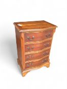 A contemporary reproduction of a bow fronted chest