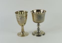 Two silver goblets, one plain and the other emboss