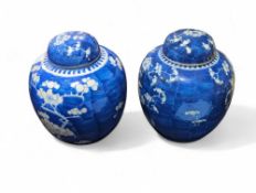 A near pair of blue and white ginger jars and cove