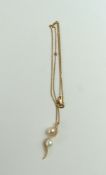 An 18ct rose gold cultured pearl and diamond penda