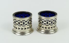 A pair of open salt pots