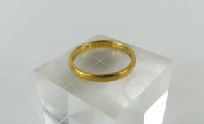 A 22ct gold wedding band, London, 1933, finger siz