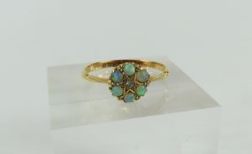 A white opal and diamond cluster ring, the small d
