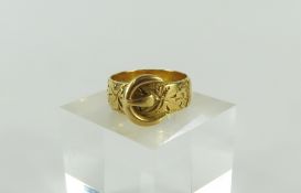 An 18ct gold buckle ring, patterned throughout, Ch
