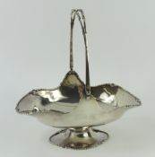 A silver basket with handle