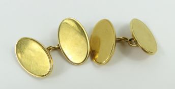 A pair of 18ct gold cufflinks, the plain oval pane