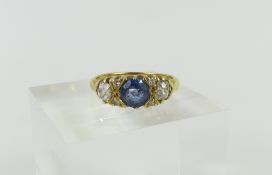 An 18ct gold sapphire and diamond ring, the round