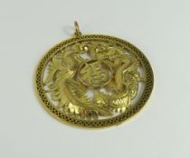 A 20th century Chinese pendant, the round disc wit