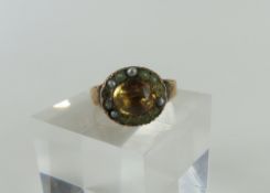 A Georgian foil backed stone ring, the oval pale y