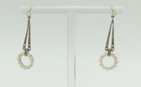 A pair of seed pearl and diamond chip drop earring