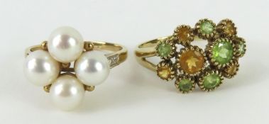 A yellow metal four pearl ring