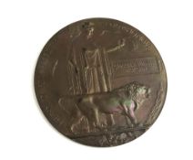 A WWI memorial death plaque in bronze