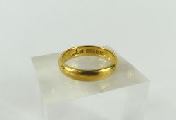 A 22ct plain gold wedding band