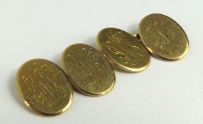 A pair of 9ct gold oval cuff links