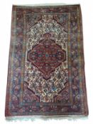 A wool rug with repeating geometric patterns and b