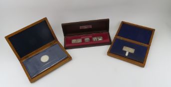 A boxed set of three sterling silver ingots celebrating Queen Elizabeth's Silver Jubilee