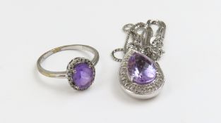 An 9ct white gold amethyst and diamond pendant necklace