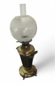 A late 19th or early 20th century brass oil lamp,