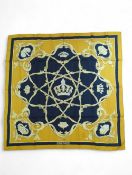 Hermes – a scarf decorated in black and gold with
