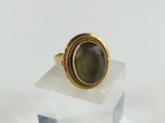 A large smoky quartz cocktail ring, the oval stone
