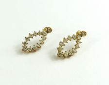 A pair of 9ct gold yellow diamond drop earrings