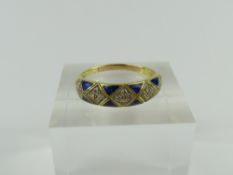 An 18ct gold diamond and royal blue enamel dress r