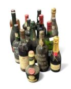 A collection of fifteen bottled alcoholic drinks,