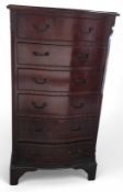 A tall mahogany chest of drawers