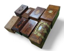 A collection of eight unique boxes and caddies. In