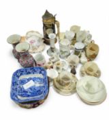 A collection of cups, mugs, dishes and other china