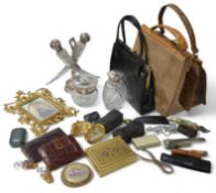 A collection of vintage items, including a double horn shaped scent bottles